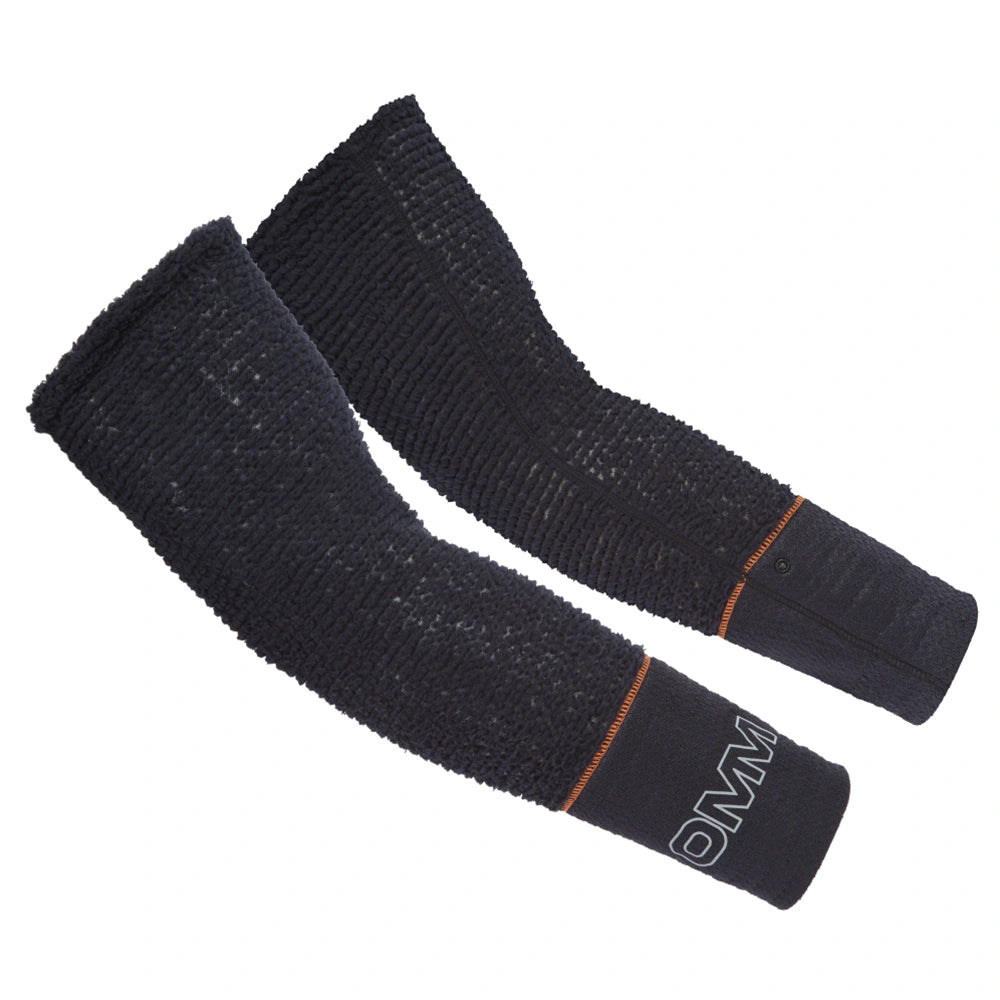 OMM Core Arm Warmers in Black, worn on the forearm showing the stretch fleece fit