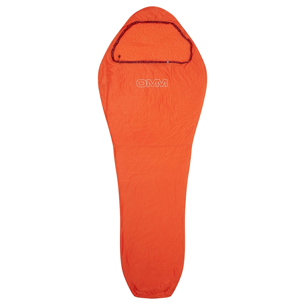 OMM Core Liner in Orange, full-length view laid flat