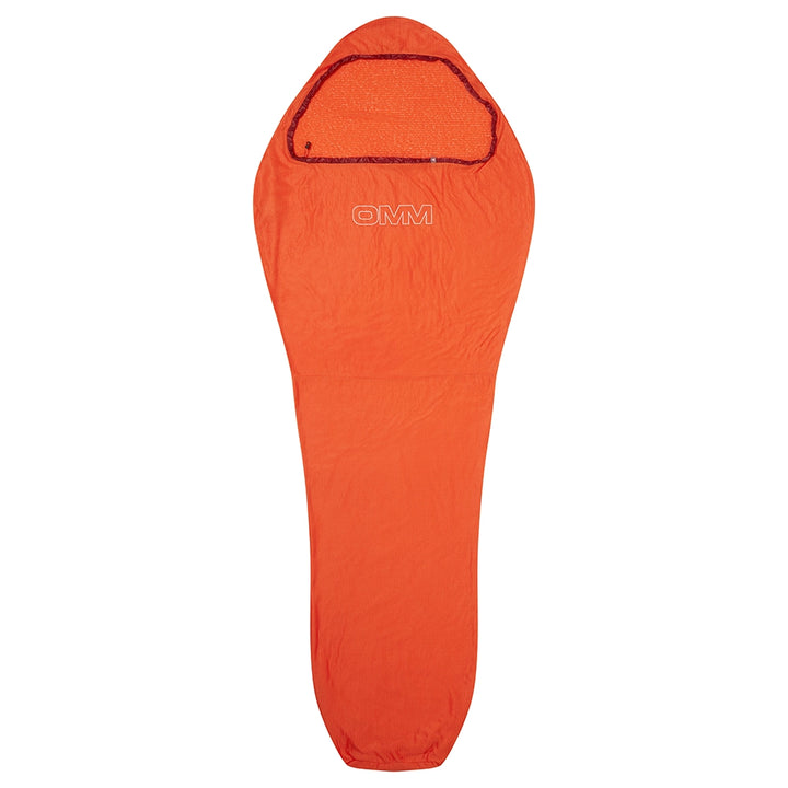 OMM Core Liner in Orange, full-length view laid flat
