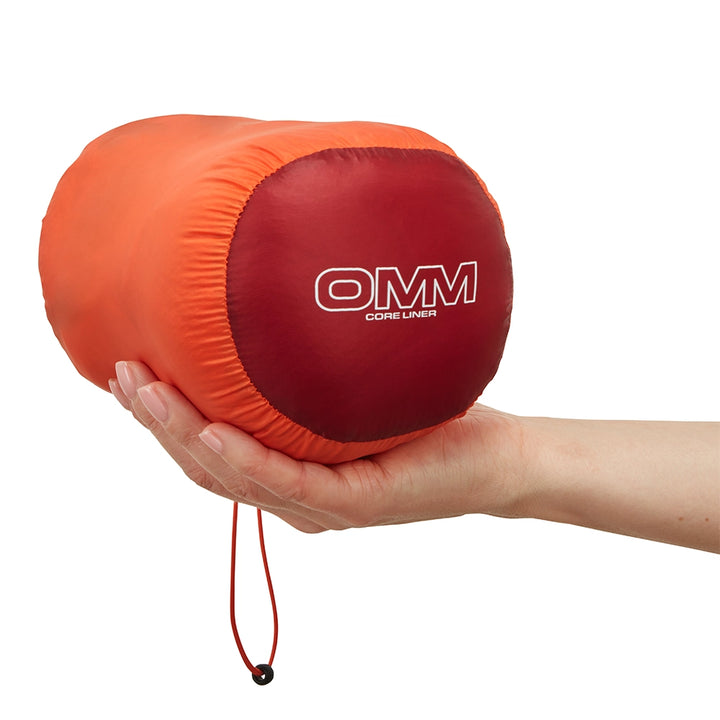 OMM Core Liner in Orange, packed into its included stuff sack