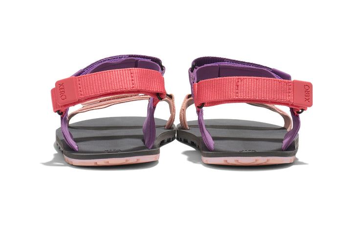 Pair of pink and purple sandals on a white background.