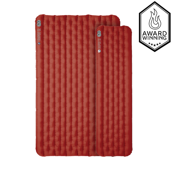 Two red sleeping pads, one longer and much wider than the other