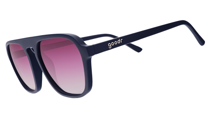 Sunglasses with pink gradient lenses and black frame on a white background