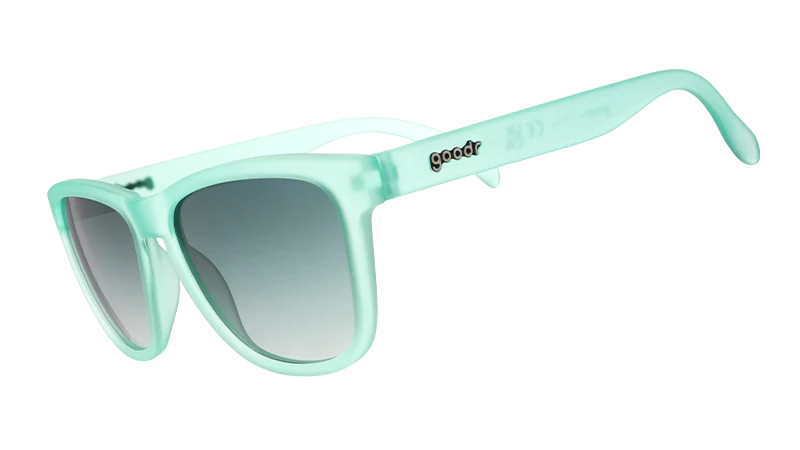 Mint green sunglasses with a gradient lens on a white background