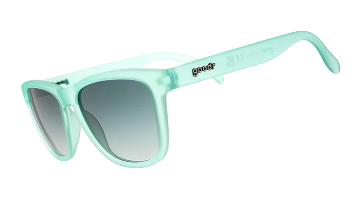 Mint green sunglasses with a gradient lens on a white background