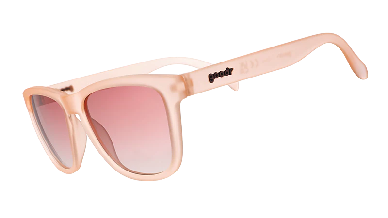Pink sunglasses with a gradient lens on a white background