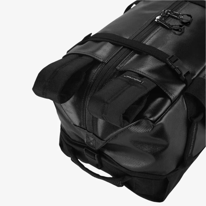 Black backpack with multiple straps on a white background