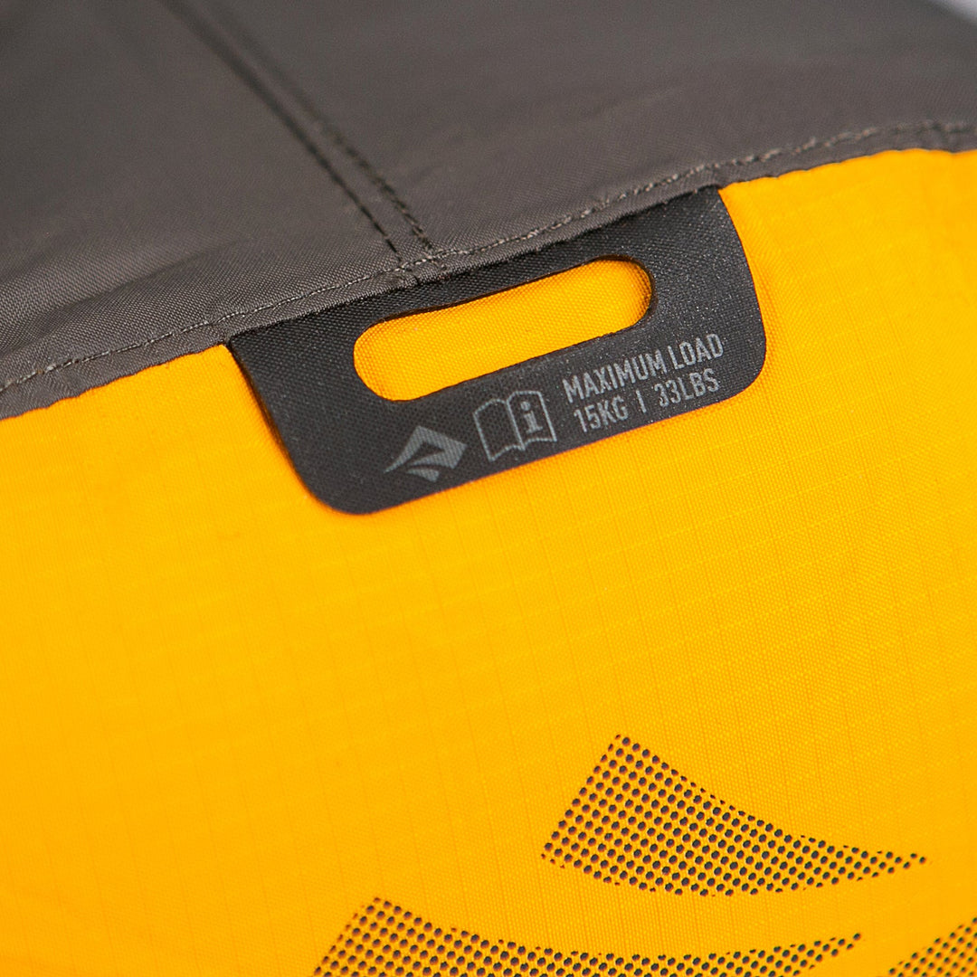 Close up of a laminated D-ring attachment point showing a warning giving a maximum load of 15kg