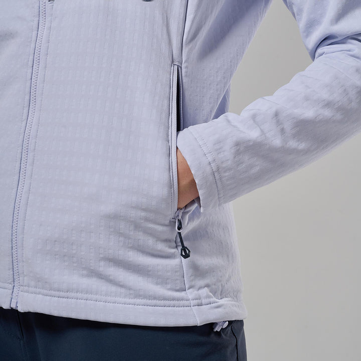 Close-up of a person wearing a light lavender-gray zip-up jacket, showing the sleeve, side zip pocket with hand inside, and textured fabric against a neutral gray background.