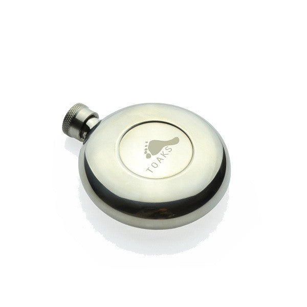 Round silver flask with the Toaks logo on a white background