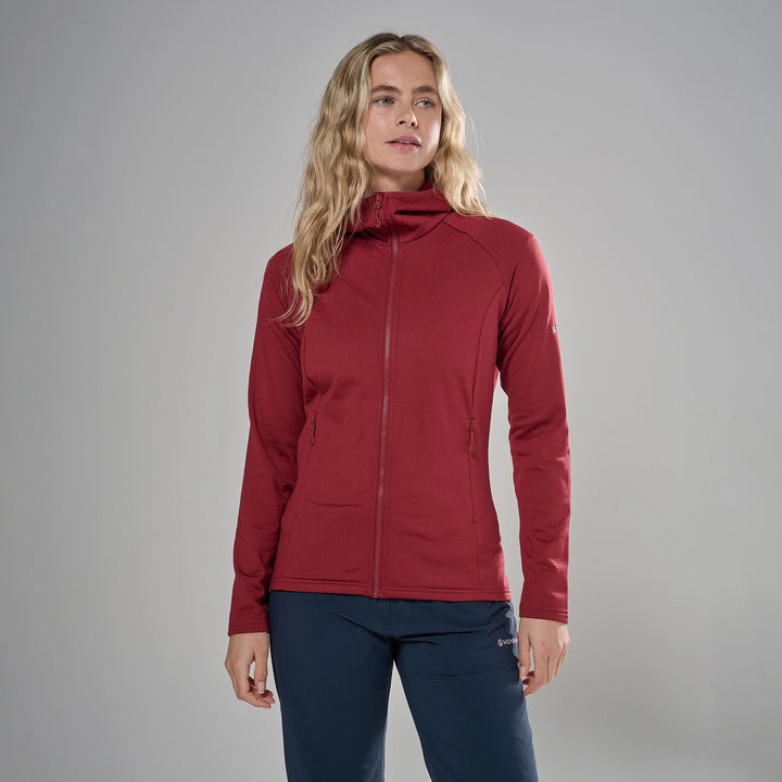 A woman modeling a red full-zip hooded jacket against a solid gray studio background.