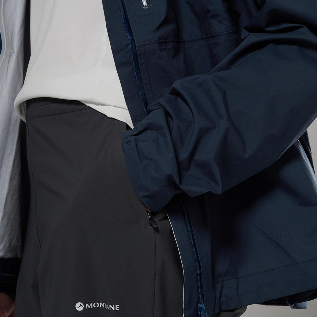 Close-up of a person wearing a dark jacket with Montane branding.