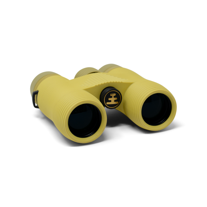 Compact yellow binoculars with Nocs Provisions logo on a white background