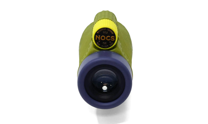 A close-up of a handheld optical device,  featuring a lime green body, a yellow adjustment knob with a black NOCS label, and a dark blue objective lens, shown on a white background.
