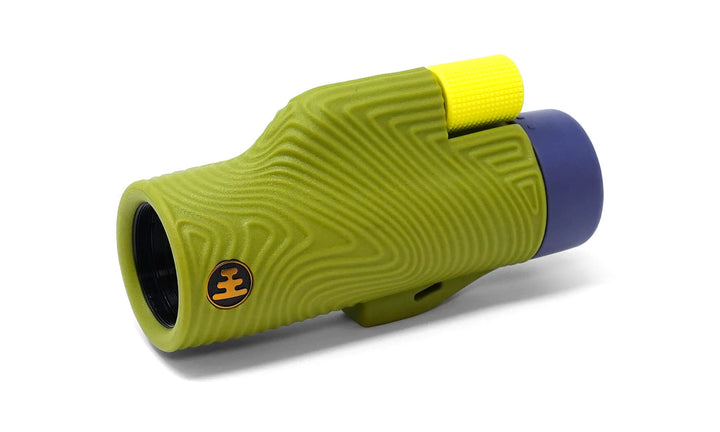 A single-lens spotting scope with a textured olive green protective cover, a bright yellow eyepiece, and a dark blue objective lens, shown on a white background.