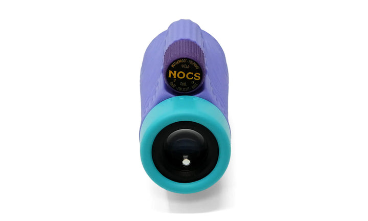 A handheld monocular with a purple textured body, a turquoise front lens housing, and a black adjustment dial featuring the yellow &
