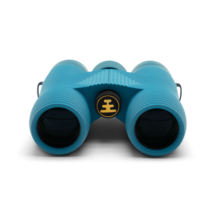 Compact blue binoculars with Nocs Provisions logo on a white background