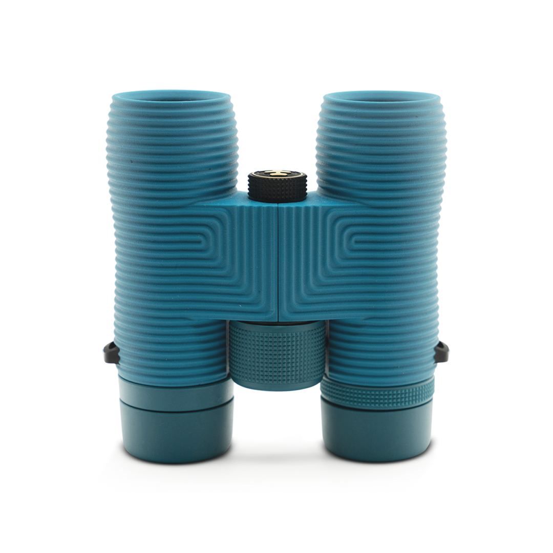 Blue binoculars on a white background viewed from below