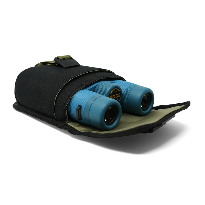Blue binoculars partially tucked into a black nylon carrying pouch with olive green trim, photographed on a clean white background.