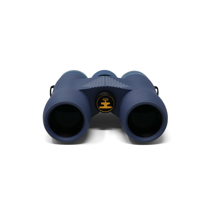 A pair of binoculars in a dark navy blue color, featuring a central circular logo with a yellow crown symbol, photographed against a clean white background.
