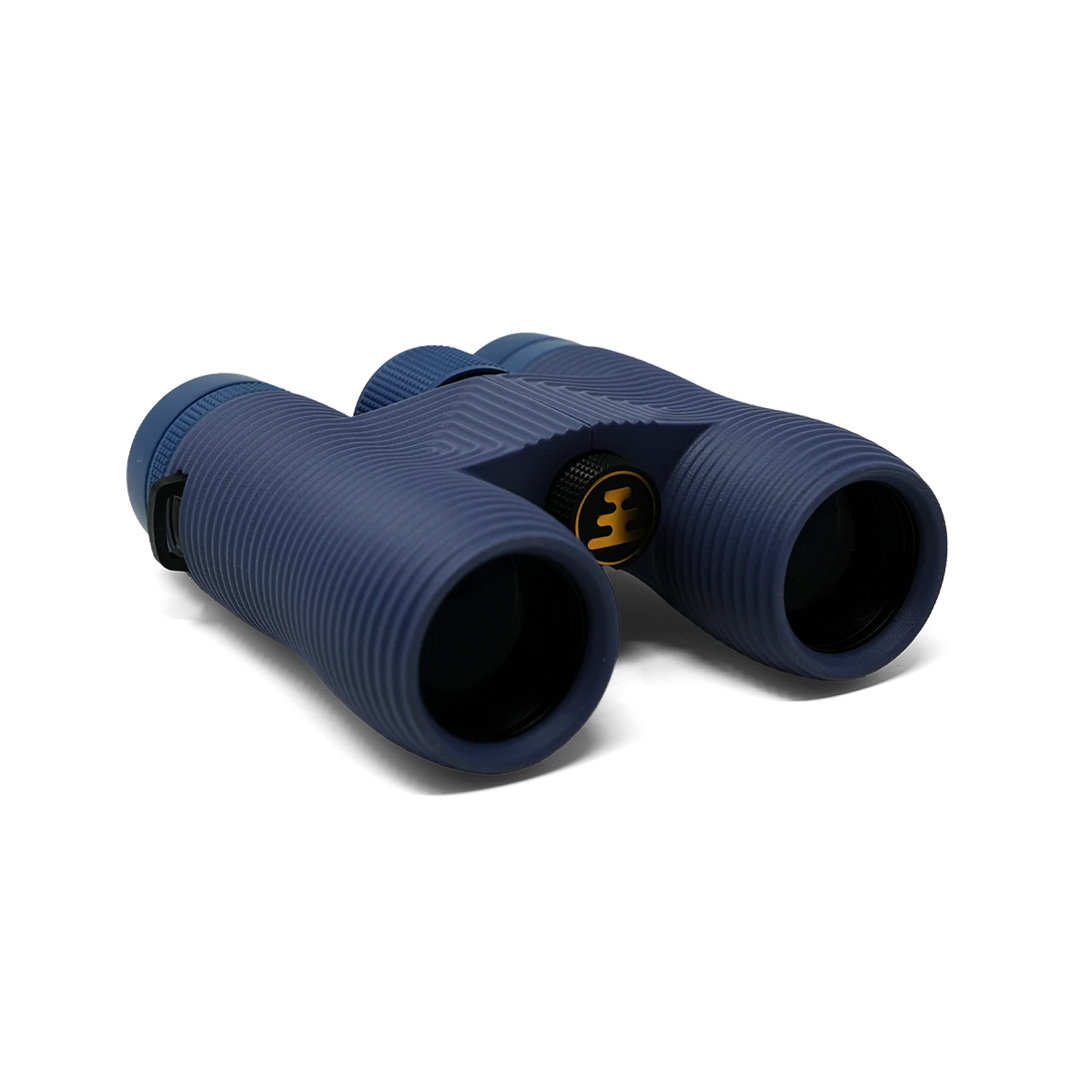 A pair of blue binoculars with a ribbed texture and a gold logo on the central hinge, shown on a clean white background.