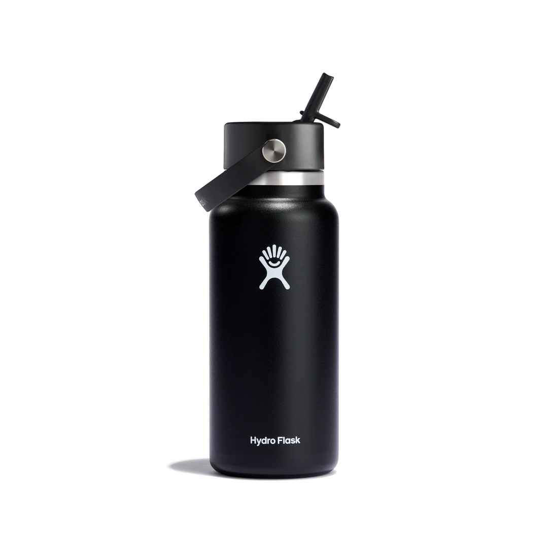 A black Hydro Flask water bottle with a black lid and straw, featuring the white Hydro Flask logo on the front, set against a plain white background.