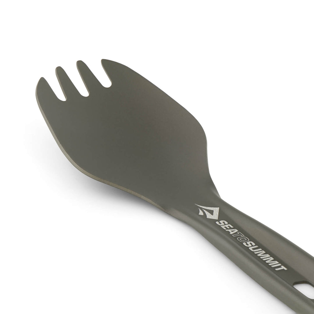 Close up of the bowl of a dark grey metal spork with the Sea to Summit logo