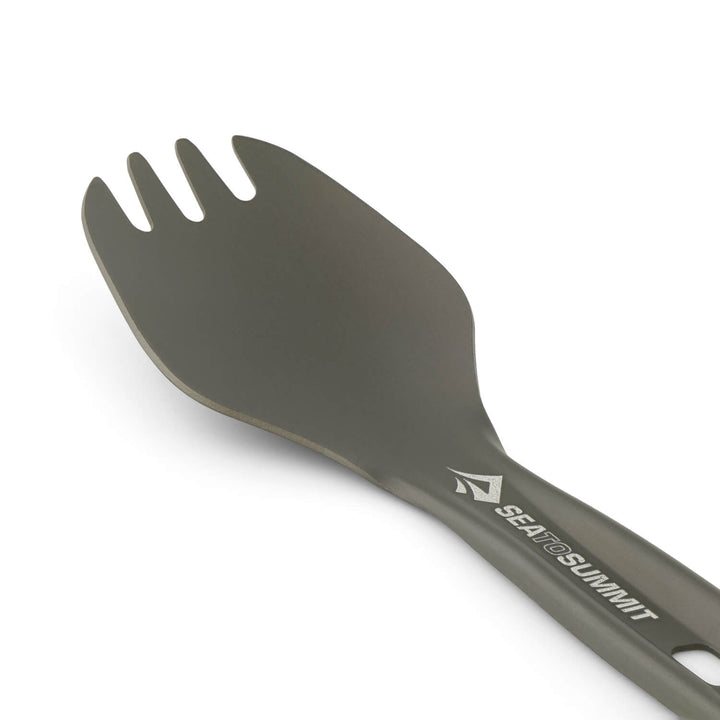Close up of the bowl of a dark grey metal spork with the Sea to Summit logo