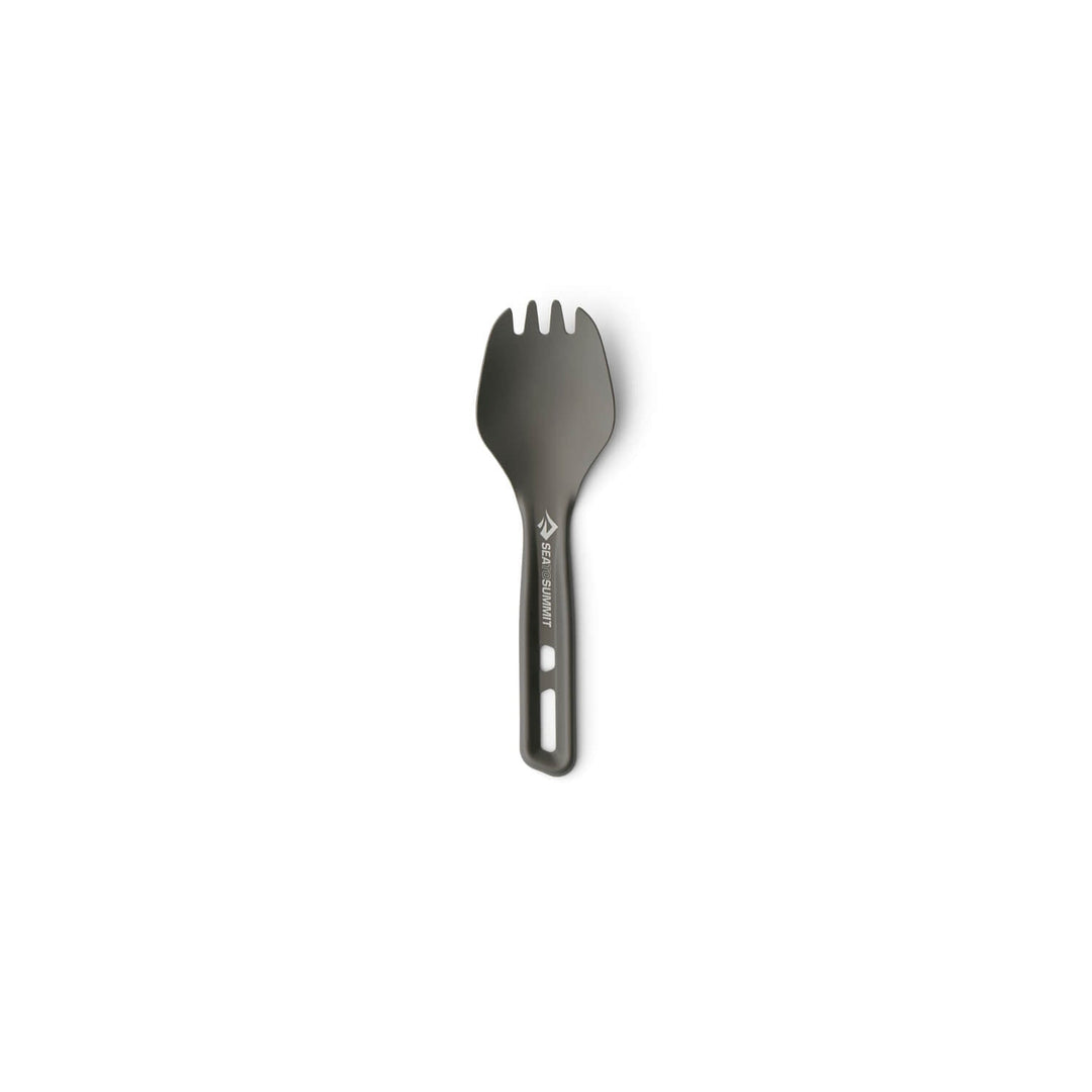 Dark grey metal spork with a very short handle on a white background