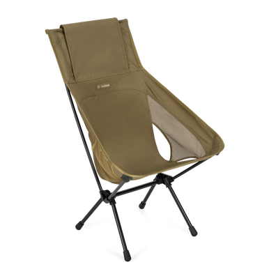A compact folding camping chair with a high backrest, upholstered in olive green fabric with a black metal tripod-style frame, shown on a plain white background.