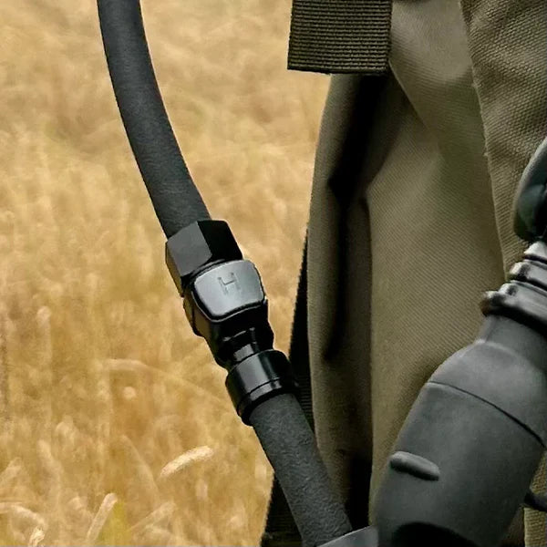 Close-up of a hydration accessory on a blurred natural background