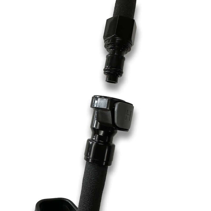 Black hydration hose fitting on a white background