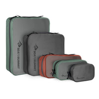 A set of five packing cubes in descending size order with translucent panel