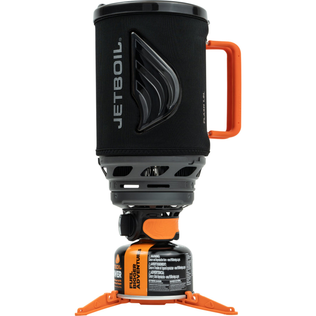 Jetboil cooking system with black cosy and orange handle and base on a white background