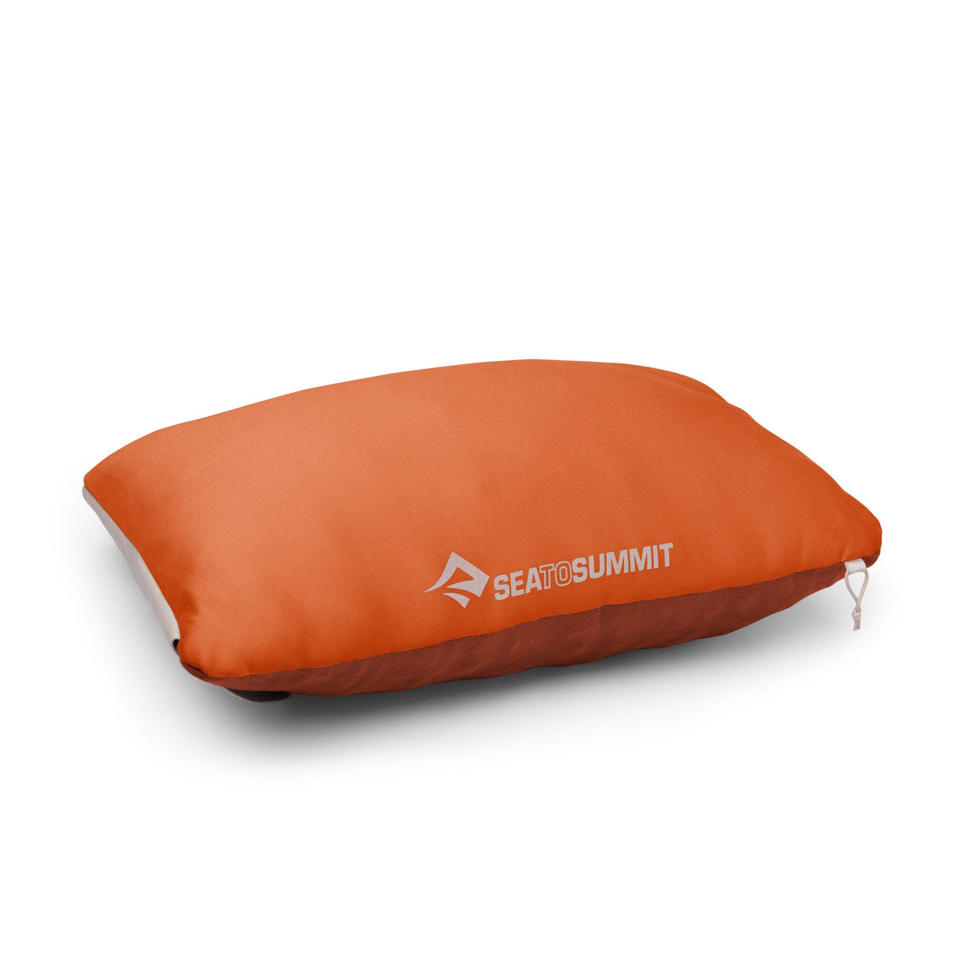 Orange camping pillow with Sea to Summit logo on a white background