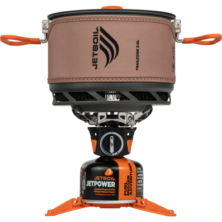 Jetboil cooking system with brown cosy and orange accents on a white background
