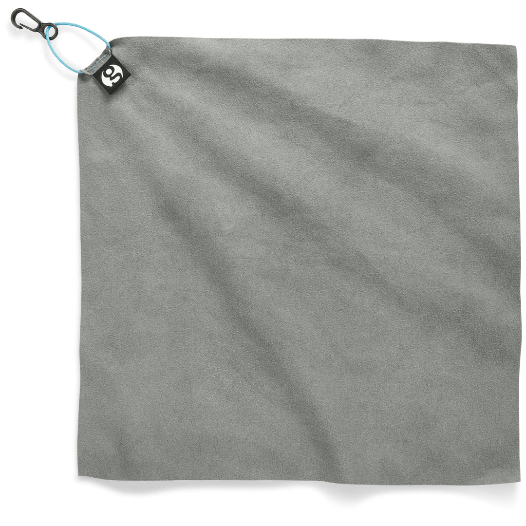 Grey towel with a Gossamer gear logo on tag on a white background