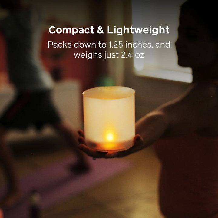 Compact light held in a hand with text about its size and weight.