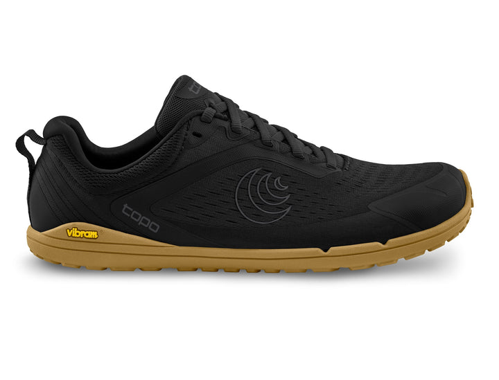 Black athletic shoe with brown sole on a white background