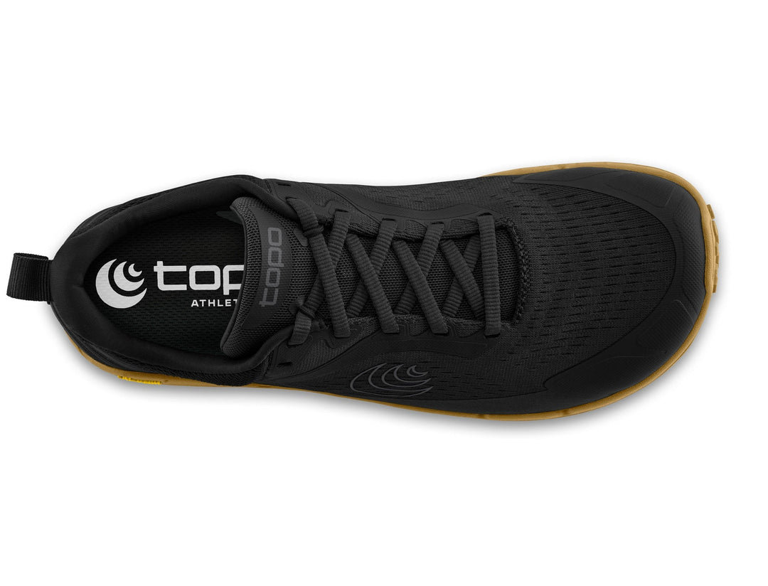 Black athletic shoe with brown sole on a white background