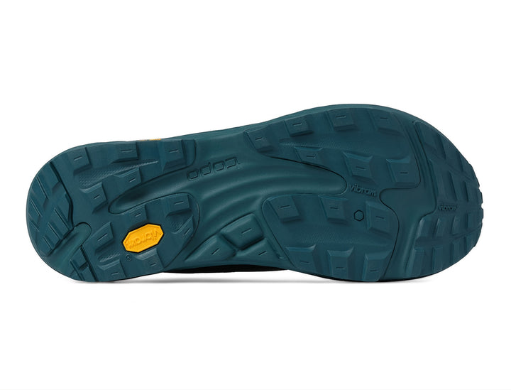 Green shoe sole with a yellow label on a white background