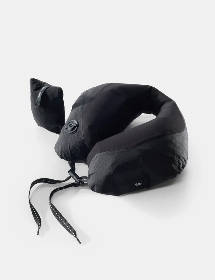 Black neck pillow on a white background