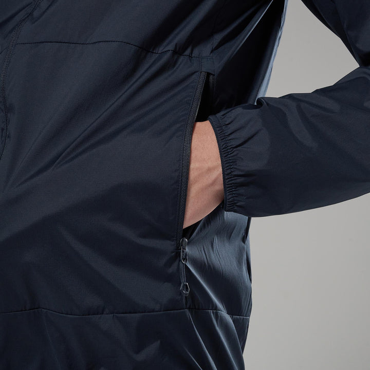 Person wearing a dark blue jacket with a gray background