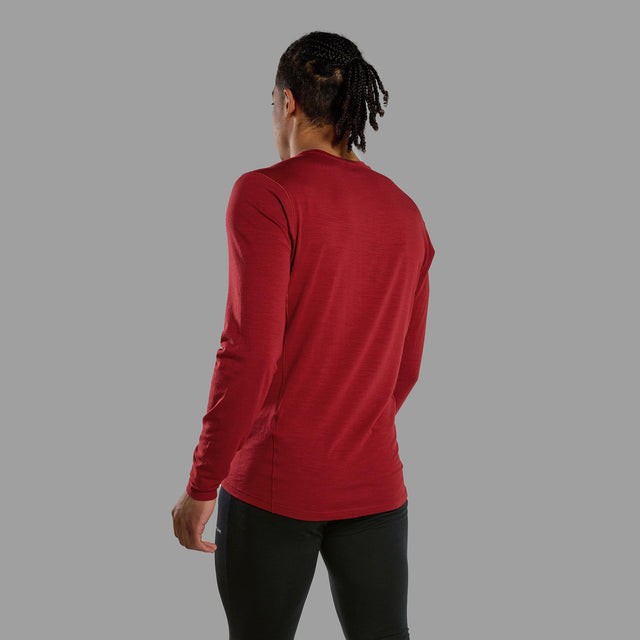 Person wearing a red long-sleeve shirt on a grey background