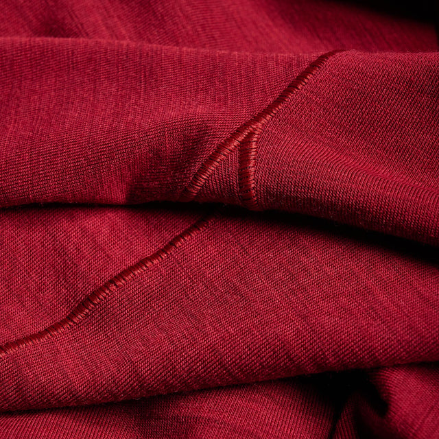 Close-up of red fabric with visible stitching