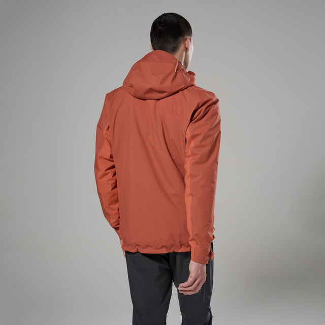 Person wearing an orange jacket on a white background from behind
