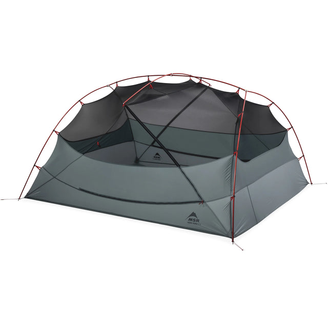 Grey camping tent inner with red poles on a white background