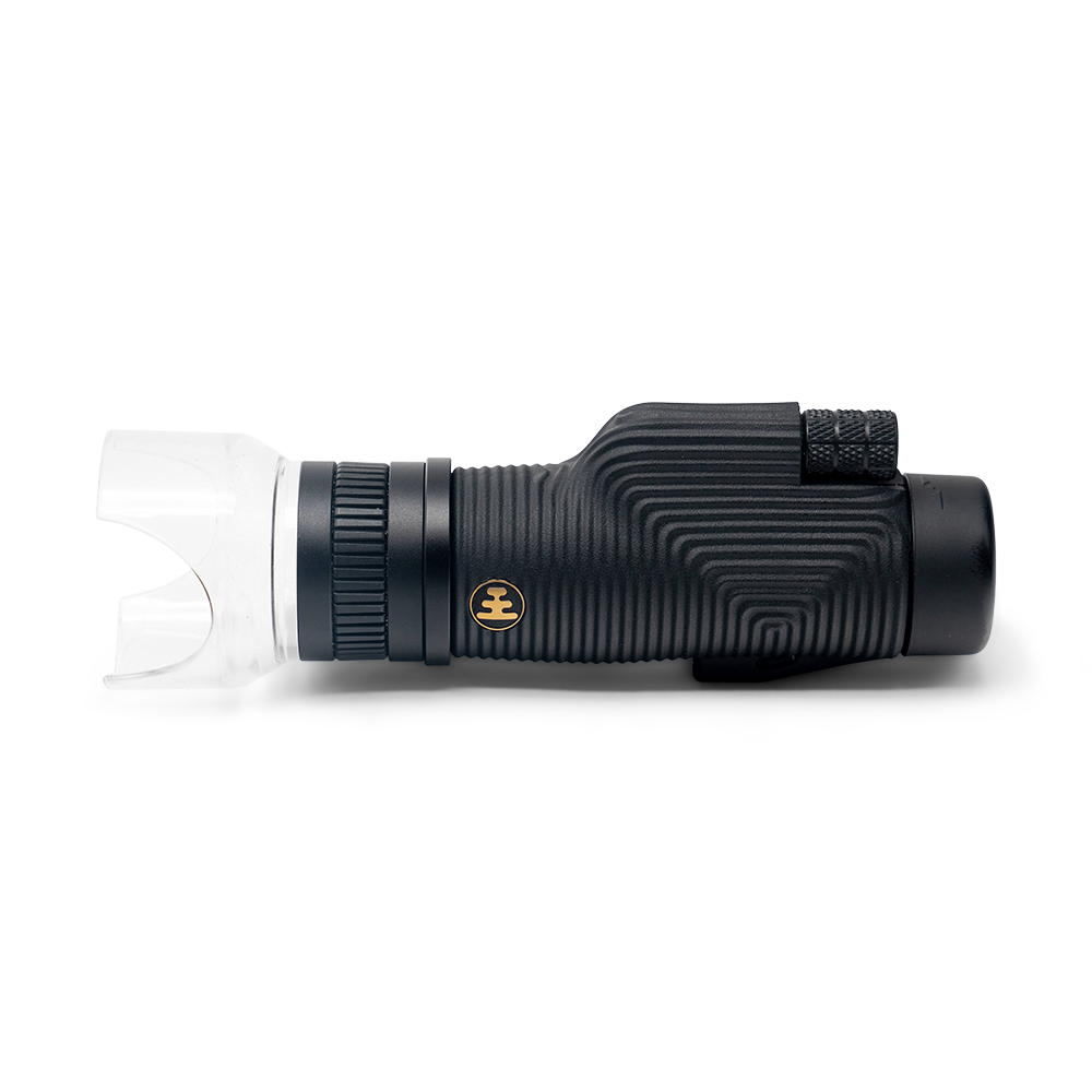 Black monocular telescope on a white background