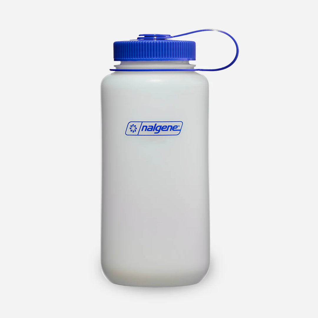 White Nalgene bottle with blue lid on a white background