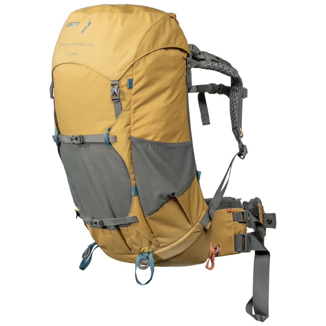Yellow and gray Aarn backpack with multiple straps on a white background